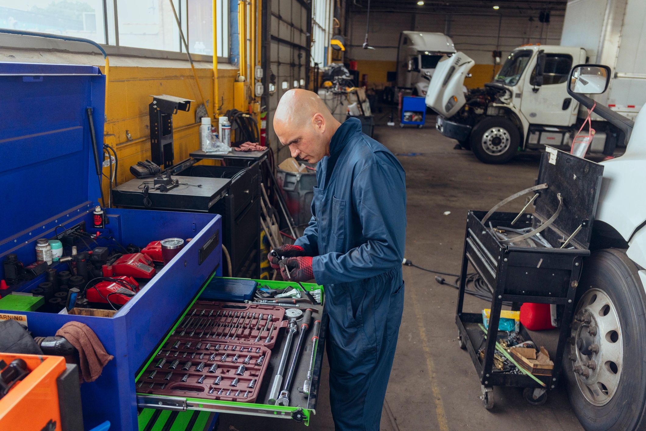 Mechanic preparing tools for vehicle service